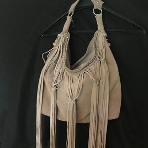 Sondra Robert’s boho suede tasseled bag